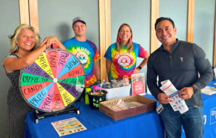 johnsonville workplace campaign kickoff raffle staff board lisa finney ryan wilinski kate baer alex castillo corporate giving donation gift to united way