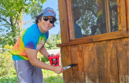 volunteer painting shed cabin day of caring 2024